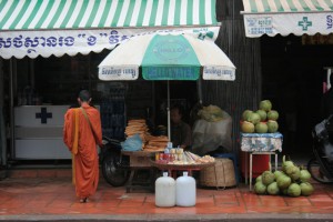 monk giving blessing on street e